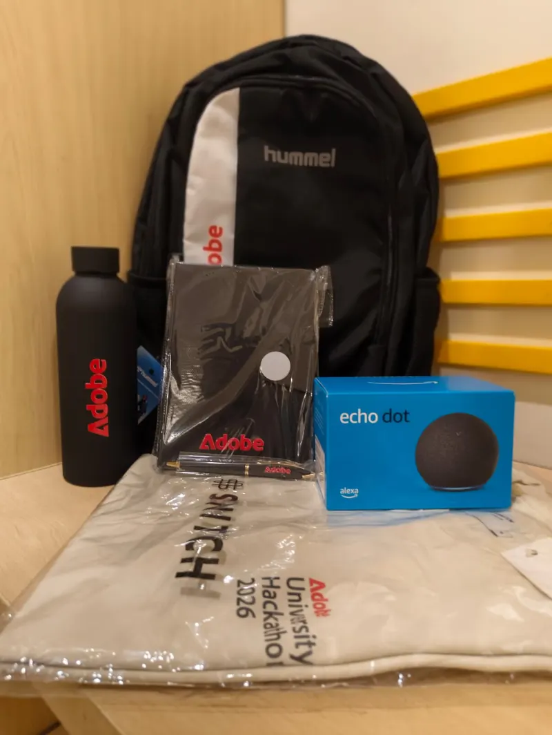 Adobe University Hackathon 2026 finalist kit: a black Adobe backpack, a black Adobe bottle, an Adobe diary and pen, an Echo Dot box and a hackathon T-shirt in its pack