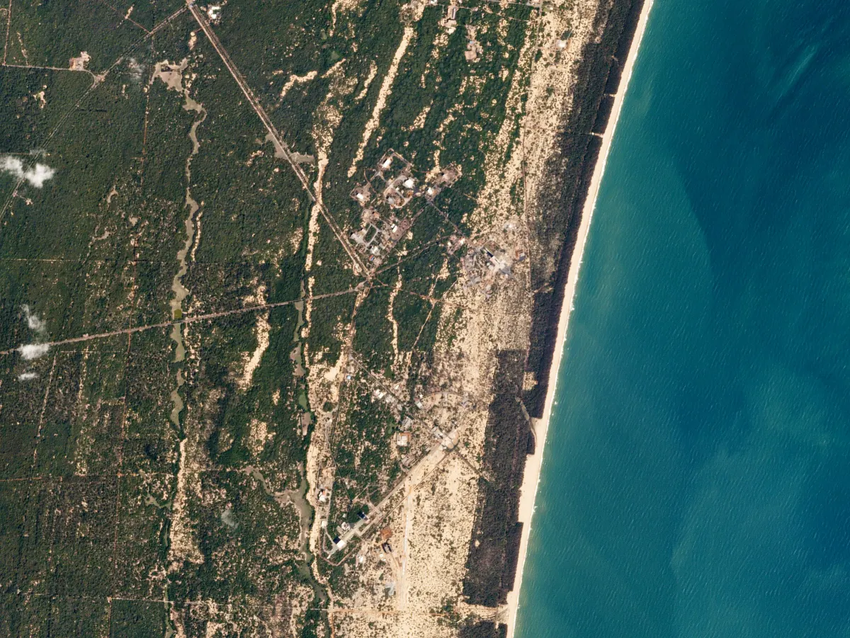 Satellite view of the Sriharikota coast, with the space centre’s roads and buildings among green forest next to the blue sea