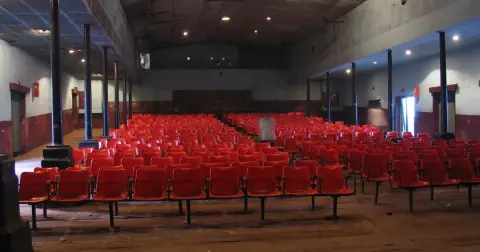 Rows of empty red seats inside the Elgin Talkies single-screen cinema hall in Bengaluru
