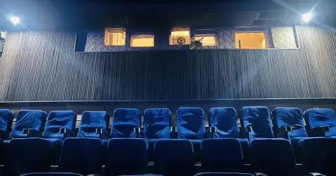 Empty rows of blue cinema seats inside the New Empire cinema hall in Kolkata